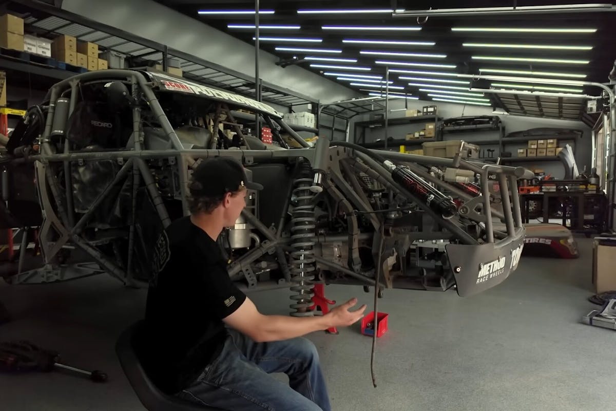 christopher polvoorde showing the damages to his truck