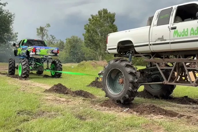Dirt Tug of War between 2 mud trucks