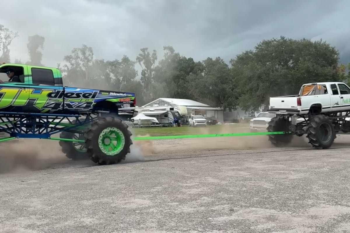Dirt Tug of War between 2 mud trucks