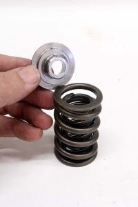 Specific springs also require dedicated retainers both to adequately locate the spring and also to ensure optimal performance. It’s important that the step in the retainer contacts the inner spring on a dual spring application to create the proper spring loads. The retainer should fit snugly into the spring. Never use a screwdriver to pry on a spring. Use only a soft plastic pry tool to free the retainer.
