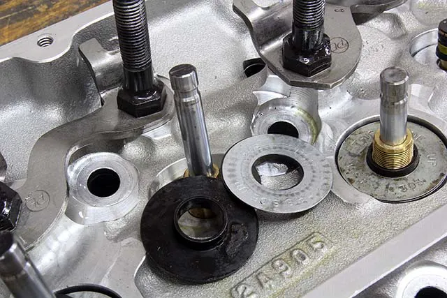 Shims can be used to dial in the installed height. Thinner shims should be placed at the bottom. If combined with a spring cup, the spacers should be placed under the cup to allow the guides to help locate the spring.