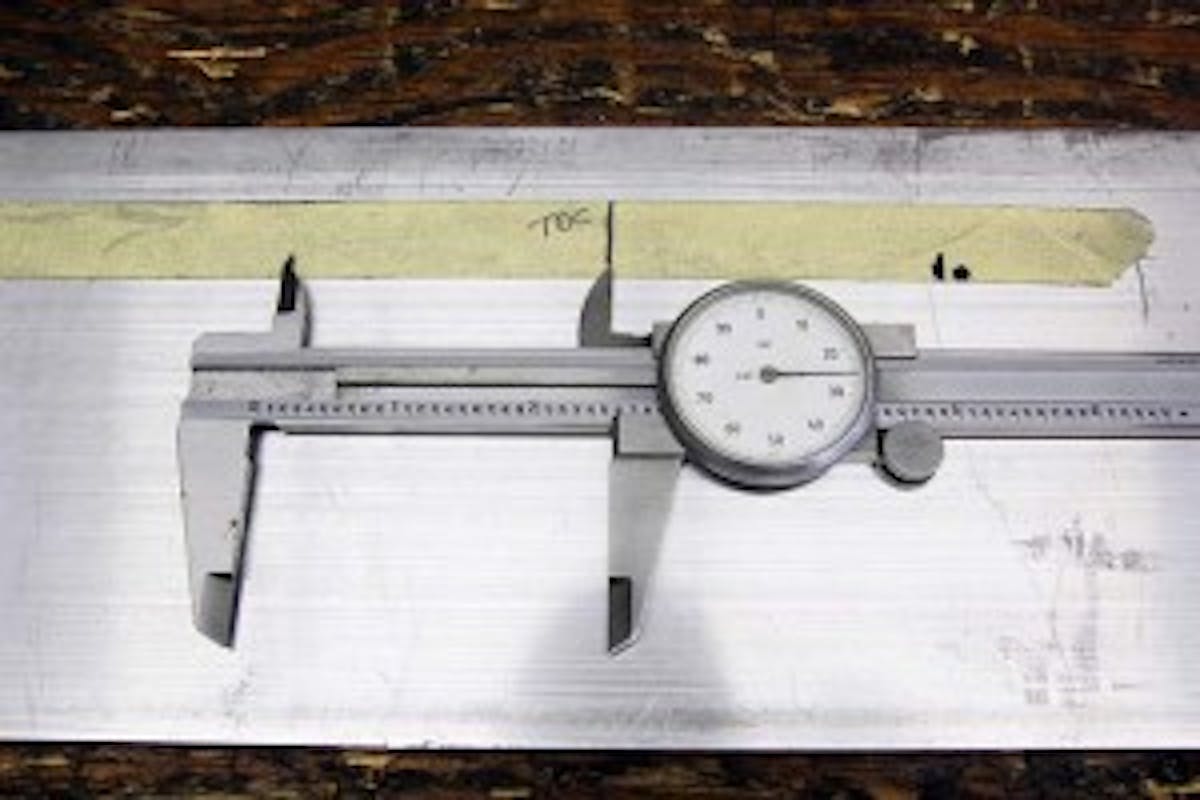Next, we laid the tape on a piece of aluminum and measured the distance from our TDC mark on the tape to the two stop positions. They were within 0.005 –inch of the same so we’ll call this accurate.