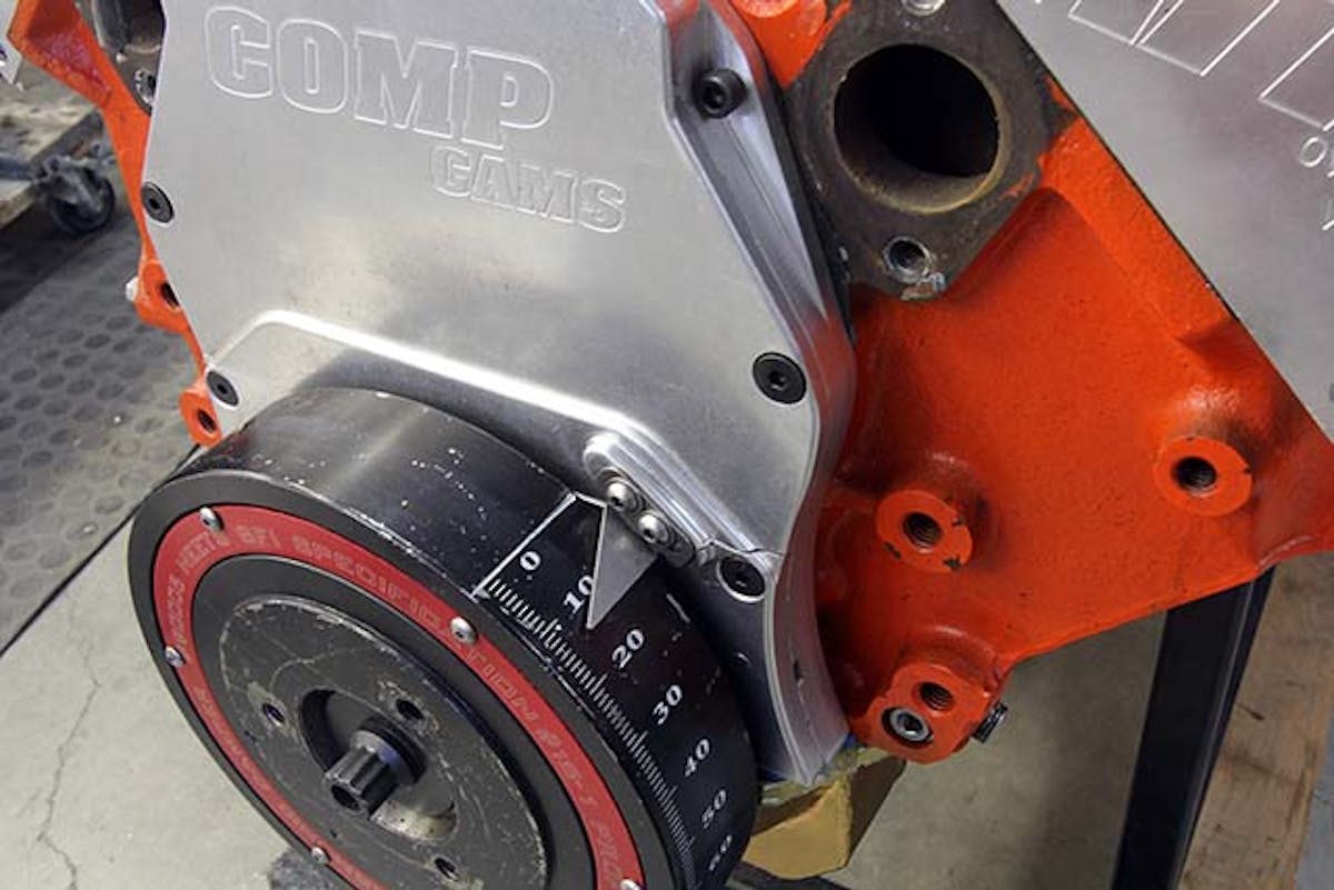 Engines with marked balancers are easy to check as you don’t need a timing tape. A standard timing light will work. Note here on this big-block that we are using the straight edge of the reference plate to indicate zero.