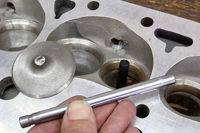 If the clay method indicates tight radial valve clearance, you may want to perform a more accurate measurement. Cut the head off a used valve (we used a cut-off wheel) and have a machinist mill the stem to create a point. Or if you have a set of transfer punches, we found they work equally well. Set the piston at TDC and use the transfer punch to lightly mark intake and exhaust centerlines.