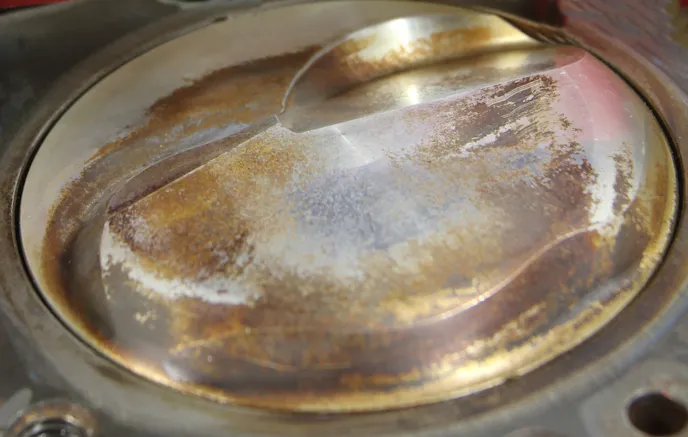 A domed piston reduces the effective volume of the combustion chamber. Older engines employed larger chambers which demanded large domes to increase compression. Newer cylinder head designs utilize much shallower and compact chambers requiring less dome to create compression.