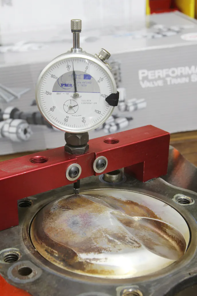 Deck height should be measured near the wrist pin centerline to minimize the effect of piston rock. If you can move the piston at TDC, note the range of the movement and average the number for deck height.