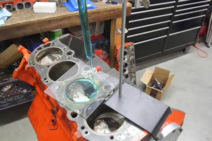 If you want to know the true volume of the dish or dome on your pistons, mock up a cylinder with the piston a set distance in the hole and measure the volume with a burette. Compare what you measure to the calculated volume for a cylinder with a true flat top piston. The measured volumes will either be less with a domed piston or more with a dished piston compared to the calculated volume. This technique also takes into account the crevice volume.