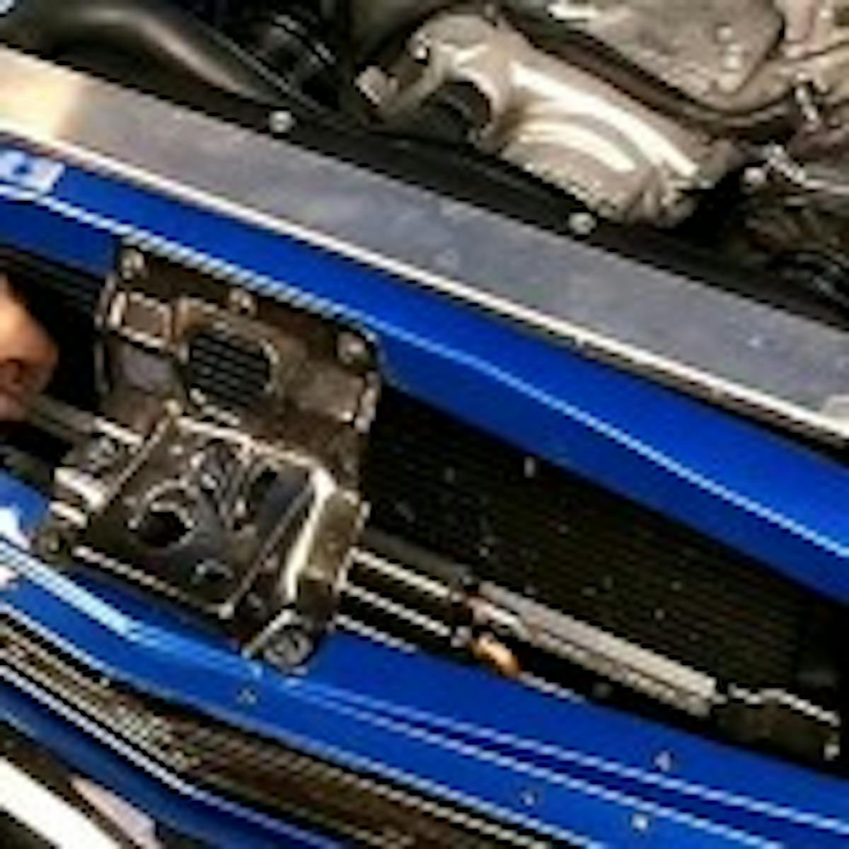 Once you have both center sections of the brackets attached to the cooler, install the cooler in front of the radiator by attaching the center sections to the sides you've already secured to the radiator. If you need to adjust anything, simply loosen the T-nuts securing the brackets to the radiator and slide them to the position you need.