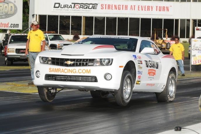 Class legal cars like the SAM Racing 2012 (updated to 2014 body specs) runs a CC/Stock Automatic class legal LS7-based 427 with an A-1 TH3350 trans and converter. The Camaro, driven by Brian Massingill, has run a best of 9.14 at 145 mph and it gets there on a very strong torque curve combined with excellent peak horsepower – none of which the SAM folks are willing to divulge!