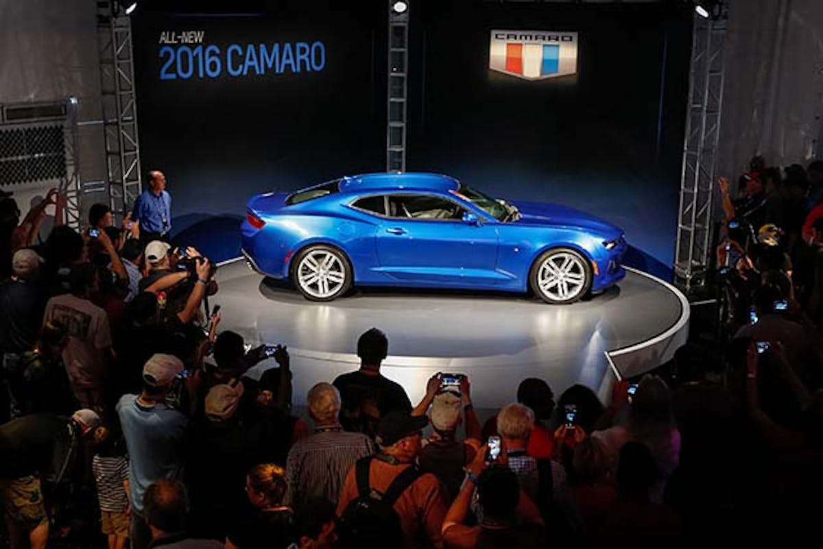 Camaro enthusiasts get a closer look at the 2016 Chevrolet Camaro after its world debut Saturday, May 16, 2015 on Belle Isle in Detroit, Michigan. The sixth-generation Camaro is faster, lighter and more nimble. Engine options include a 2.0L Turbo, an all-new 3.6L V-6 and the LT1 6.2L V-8, which is SAE-certified at 455 horsepower and 455 lb-ft of torque – for the most powerful Camaro SS ever. Each engine is available with a six-speed manual or eight-speed automatic transmission. (Photo by Jeffrey Sauger for Chevrolet)