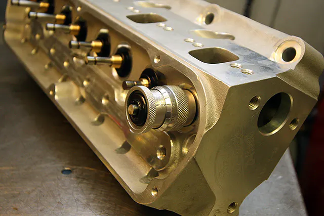 Valve spring installed height is a critical consideration for any valvetrain. It influences the spring pressure both with the valve on the seat and fully open. A valve spring height mic is the easiest, most consistent way to accurately measure installed height.