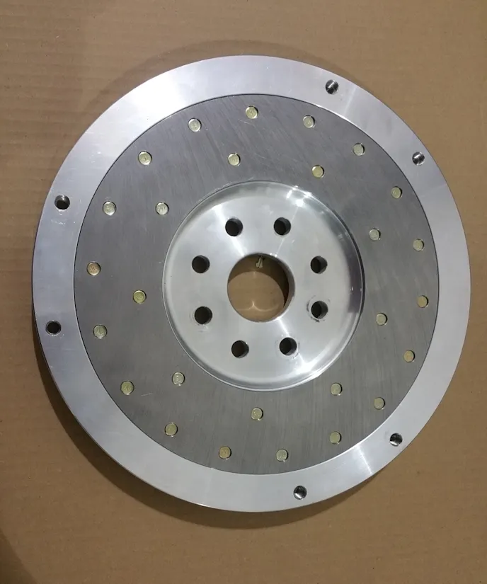 Clutch side of Alum. Flywheel has steel facing for 11 in. Long Presure plate.