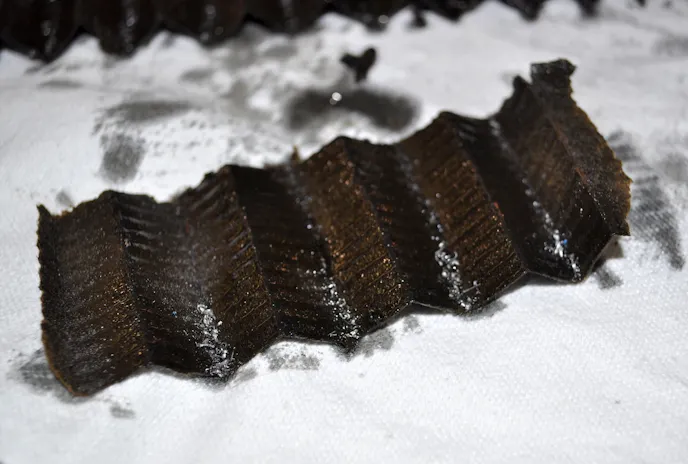 This many metal shavings in an oil filter most likely mean engine component failure.