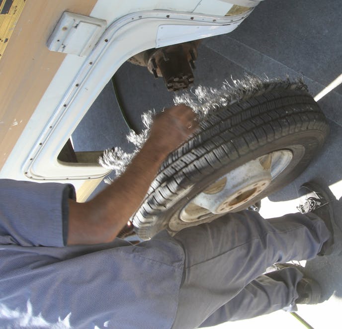 On our trip north, the motorhome suffered a left-rear blow-out, but Tim limped it to a nearby tire store. There, we discovered the left rear inside tire was also goose-egged. The tires had less than 4,000 miles on them, but Tim says they came from North Korea! After a $440 setback for two new Firestone tires, we were back on the road.