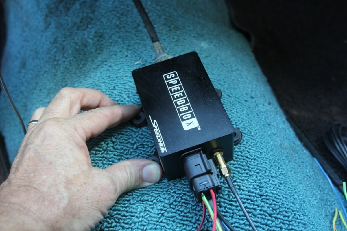 We executed a quick SpeedBox road test the moment it arrived. We placed it on the floor of the interior, wired it up, placed GPS antenna on the dash under the windshield, and connected the speedometer cable. Granted our El Camino is a bit loud, but we couldn’t hear it running or feel any vibrations from the unit while it was running.