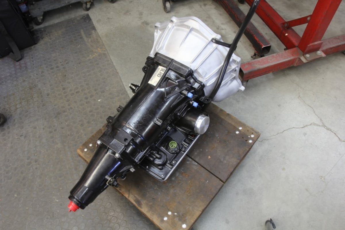 This is our 4L60E four-speed electronically controlled overdrive automatic. The VSS output is located on the extension housing. All we have to do is connect the SpeedBox’s yellow/green wire to the output terminal on the VSS, calibrate the speedometer, and we’re done. We did have to dig up a VSS two-wire connector.