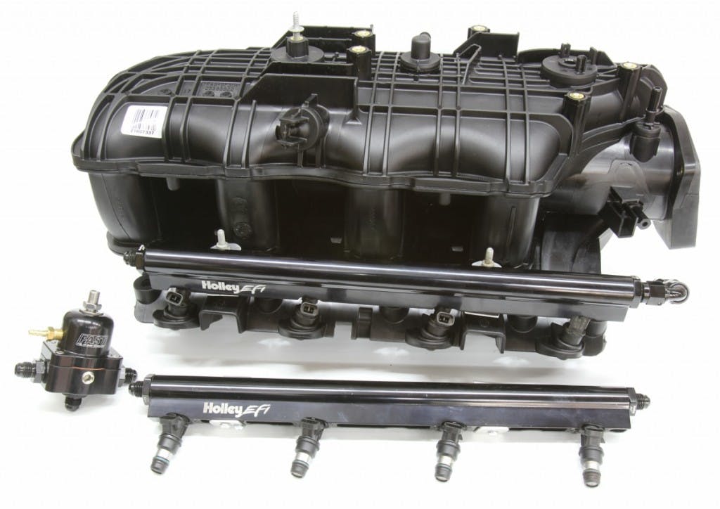 The Trailblazer SS intake makes more horsepower than an LS6 and more torque than the truck intakes. It also requires a factory fuel rail specific to this intake. A Holley LS1 fuel rail will fit, but we had to make simple custom aluminum Z-brackets. This arrangement will also need a fuel regulator.