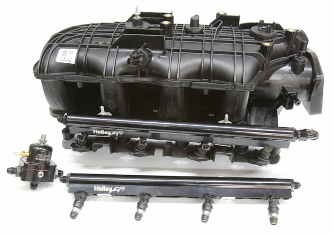 The Trailblazer SS intake makes more horsepower than an LS6 and more torque than the truck intakes. It also requires a factory fuel rail specific to this intake. A Holley LS1 fuel rail will fit, but we had to make simple custom aluminum Z-brackets. This arrangement will also need a fuel regulator.