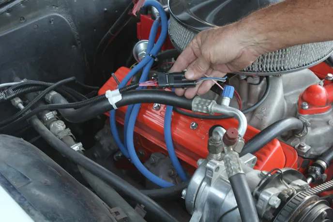 We had just installed a 4L60E electronically-controlled overdrive into our ’64 El Camino when it began shifting erratically — caused by the TPS wires routed too close to what we thought were good, spiral-wrap spark plug wires. We simply relocated the TPS sensor wires a few inches away from the spark plug wires, and the issue disappeared.