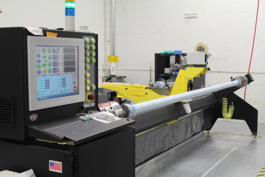 This magnificent piece of machinery allows QA1 to control the manufacturing processes for creating a carbon fiber driveshaft. Once the driveshaft has been designed and data input, the machine takes it from there.