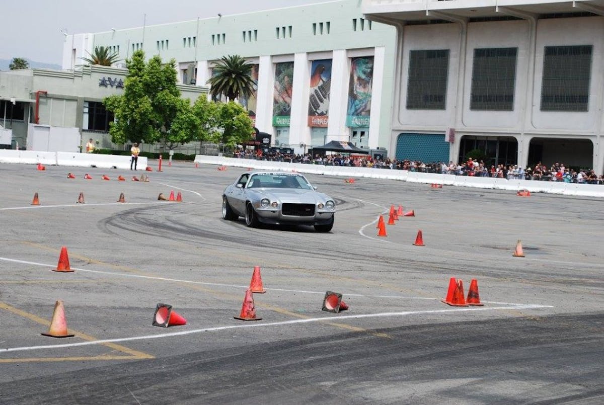 Gerald Lum cranks his '71 Camaro Z/28 through the cones of the autocross. Lum bought this car new in '71 nad has raced it ever since.