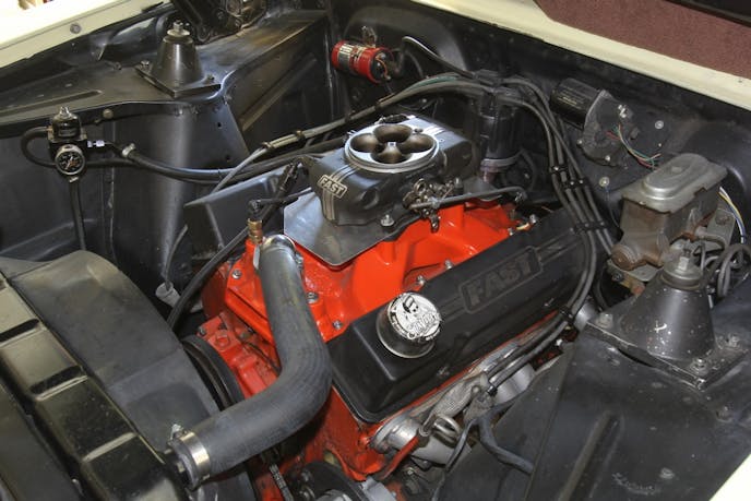 This is the engine compartment on Bianchi’s 355c.i. Nova. The car is a four-speed with 3.08:1 rear gears, so improving off-idle performance is important since the majority of his driving is around town at part throttle. 