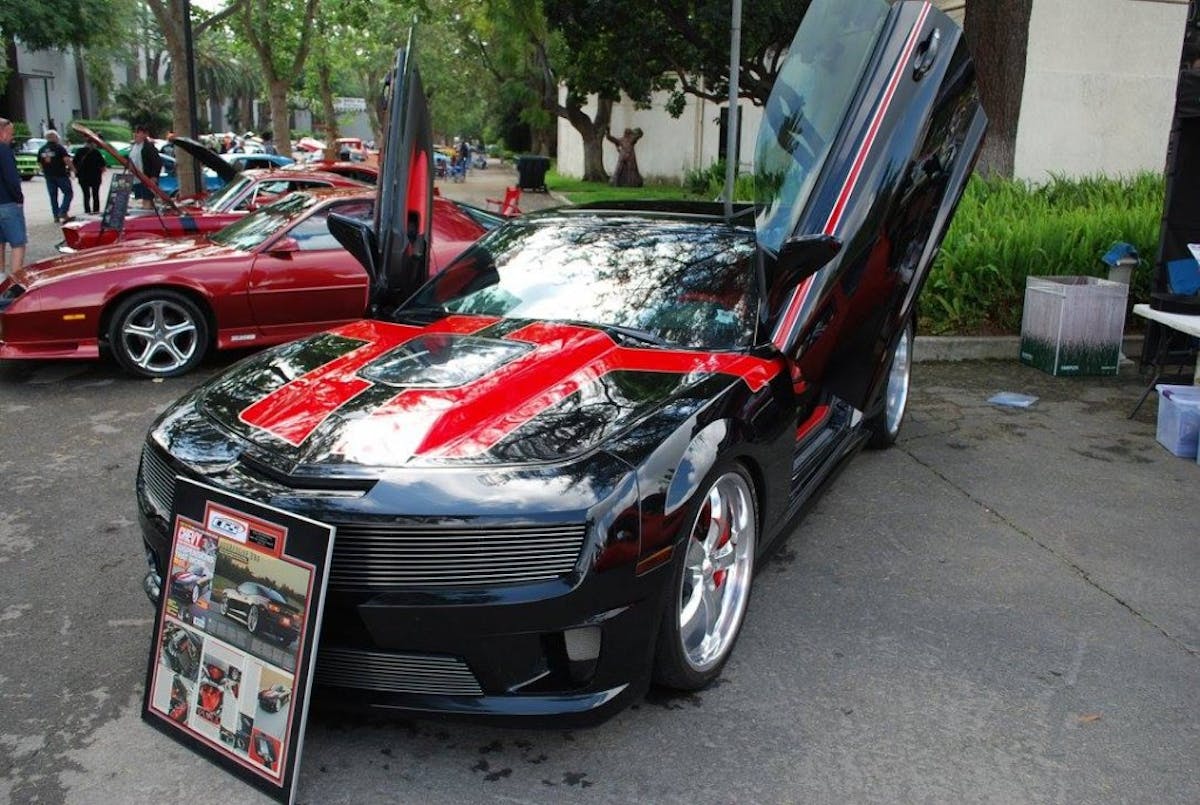Flip up doors make for an interesting look. This 5th Gen Camaro is a wild custom for certain.