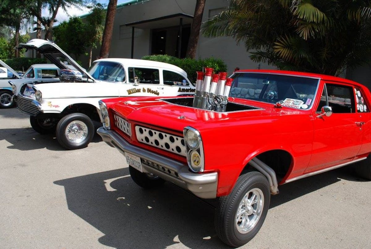 The Gasser craze is on. Not only where their cool '57's but also this very unique '65 Pontiac with swiss cheese grille and bumper. 
