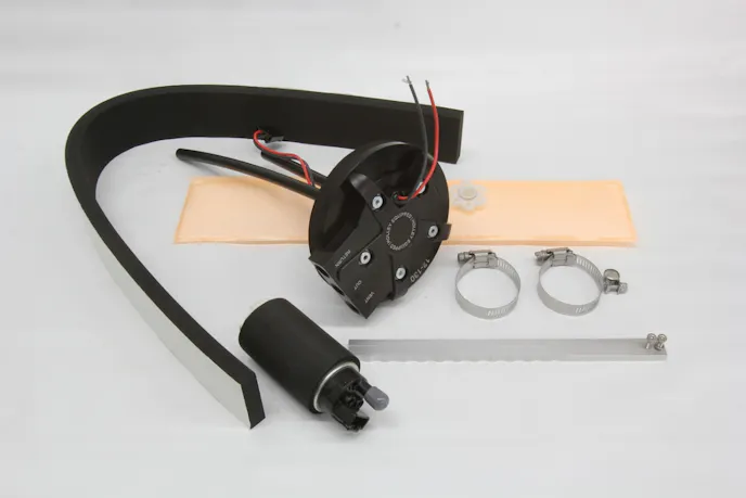 The Holley retro-fit fuel pump conversion includes the usual aluminum lid, but instead of a reservoir, uses its HydraMat material as the fuel pickup and inlet filter. As long as some portion of the mat is in contact with fuel, the rest of the mat closes so only fuel is pulled into the pump inlet. It’s pretty slick. 