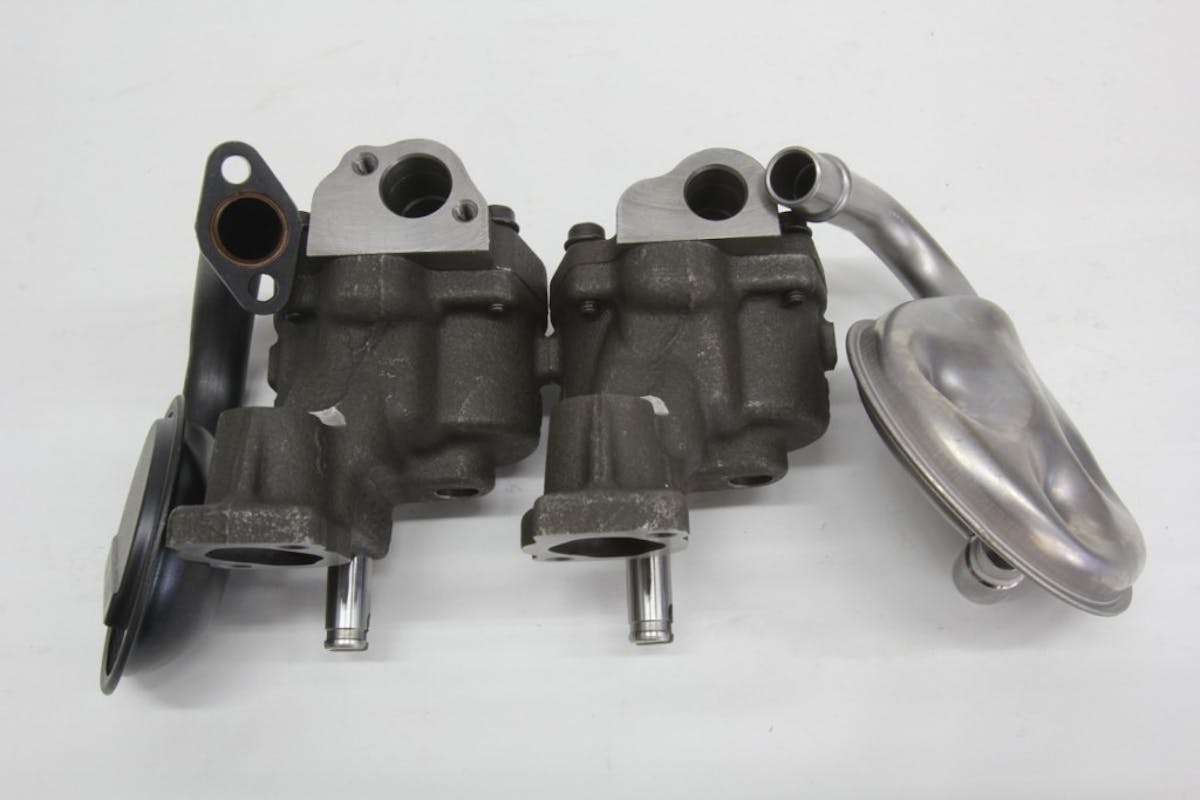 This comparison of the pump inlets reveals a couple of important items. Standard small-block pumps use a 5/8-inch inlet. An optional ¾-inch inlet reduced restriction, which improves pump efficiency. ST pumps (left) also offer the option to use either a press-in or bolt-on pickup while standard pumps only use a press-in pickup.  The fasteners can also be safety-wired or tack welded to the pump for additional insurance.