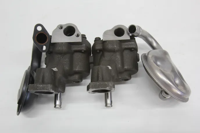 This comparison of the pump inlets reveals a couple of important items. Standard small-block pumps use a 5/8-inch inlet. An optional ¾-inch inlet reduced restriction, which improves pump efficiency. ST pumps (left) also offer the option to use either a press-in or bolt-on pickup while standard pumps only use a press-in pickup. The fasteners can also be safety-wired or tack welded to the pump for additional insurance.