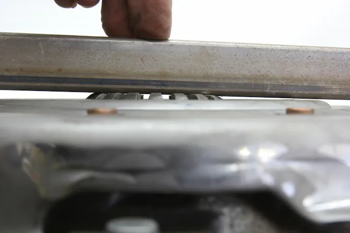 Pressure plate levers low on one side This photo reveals the pressure plate fingers are not even close to being at a consistent height when bolted down to the flywheel. This will cause horrible clutch chatter. We tried moving the clutch disc around, but this is clearly a defective pressure plate. This is why you should always perform this inspection.