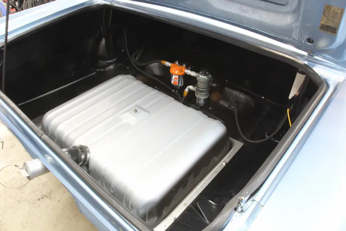 An early trick for endurance racing was to weld two bottom halves together to create a much larger fuel tank. Mike’s tank may look stock, but inside the factory sheet metal is a functioning fuel cell bladder. “It wasn’t easy adapting that bladder to fill through that