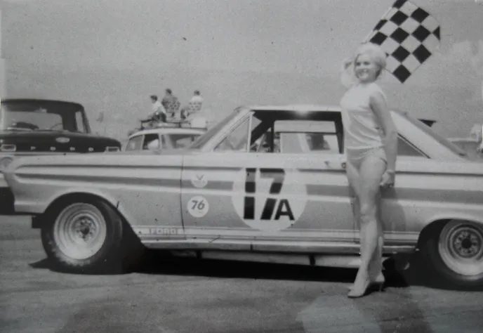 The trophy girl waves the flag over Cordts’ Falcon at the conclusion of the 1966 Trans Am race at Riverside, where he and co-driver Jim Dittemore finished sixth in the big-bore class.