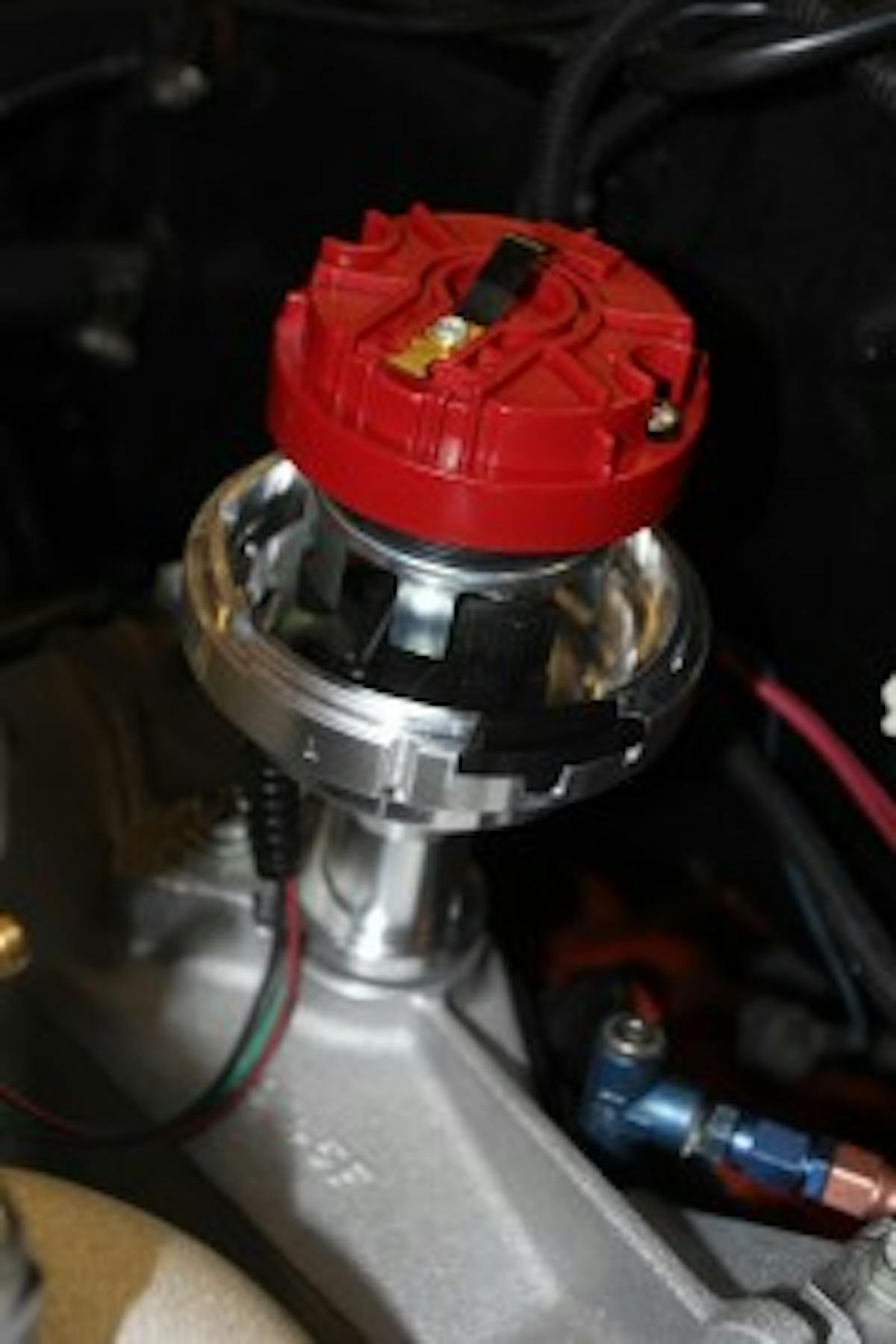 We also dropped in the optical distributor that’s part of the system. The distributor has Number 1 cylinder stamped into the body, which helps to align the rotor. The distributor cap only installs one way, so make sure you get it right.