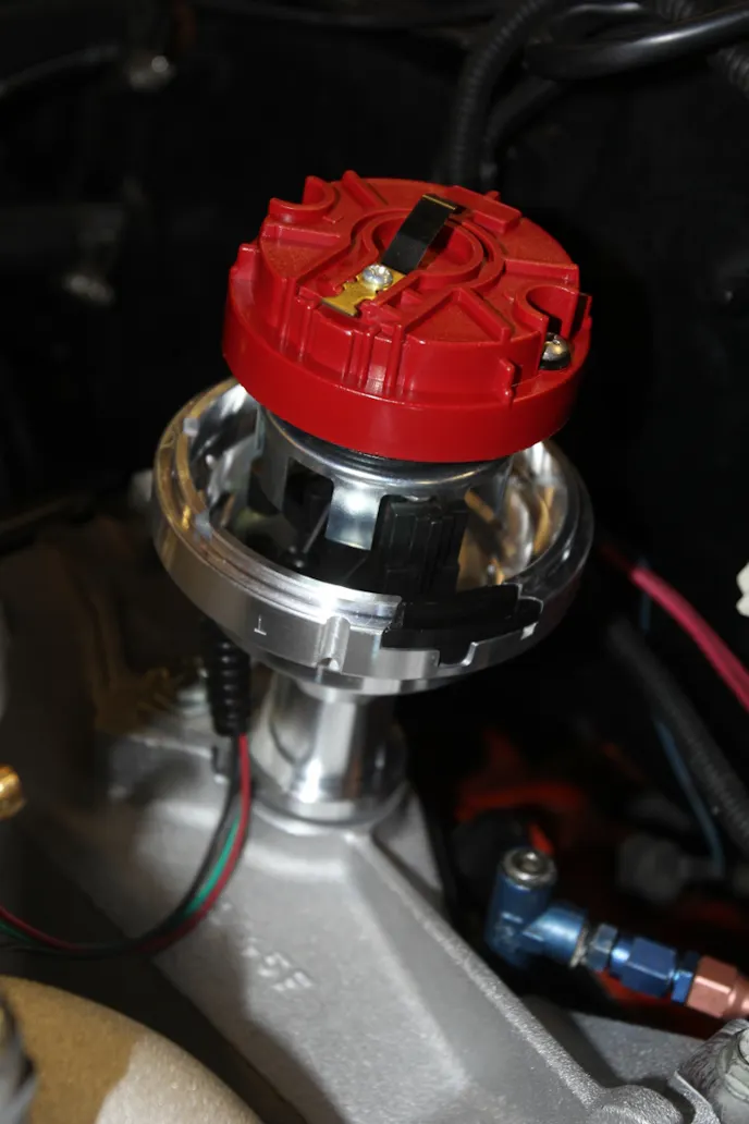 We also dropped in the optical distributor that’s part of the system. The distributor has Number 1 cylinder stamped into the body, which helps to align the rotor. The distributor cap only installs one way, so make sure you get it right. 