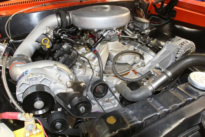 This is our supercharged 4.8L truck engine equipped with a blow-through carbureted Vortech V-3 supercharger. This iron-block truck engine sports a static compression ratio of 10.0:1 with lightly ported heads and a mild cam and makes 600 hp at the crankshaft, with only 6 psi of boost. We made this power using a 50-50 mix of Rockett 100 gas and 91 octane pump gas, which from the blending chart is a 95.5 octane rating.