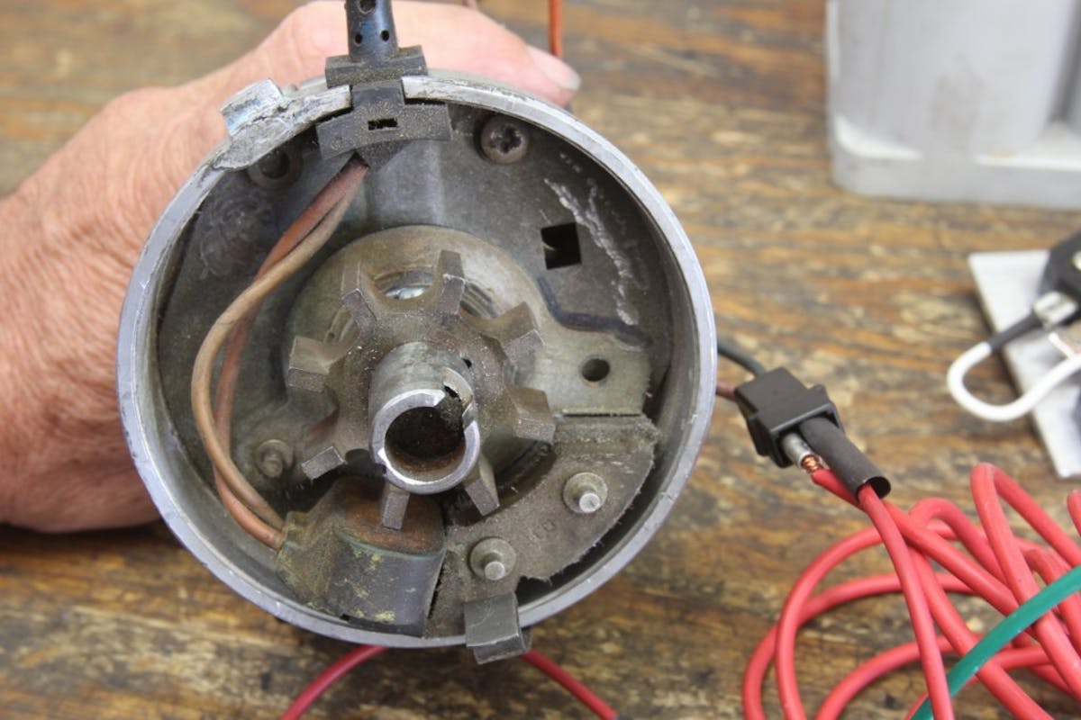 This is a Ford DuraSpark distributor our buddy, Tim Moore, pulled out of the junkyard. He eliminated the vacuum advance can and filled in the hole to make it appear more like a mid-’60s Ford dual point distributor. He has converted the wiring to a two-pin connector as used on an MSD distributor. We can now use this distributor to trigger an HEI module.